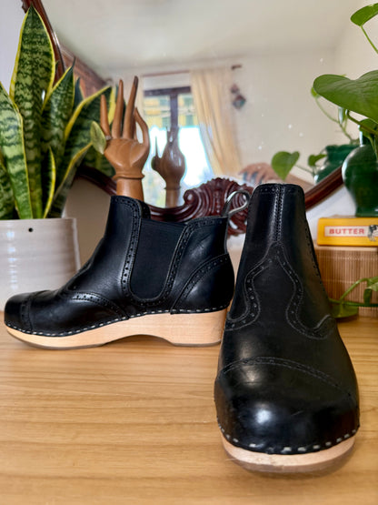 Black leather Swedish Haskbeen bottles with tooled leather detailing
