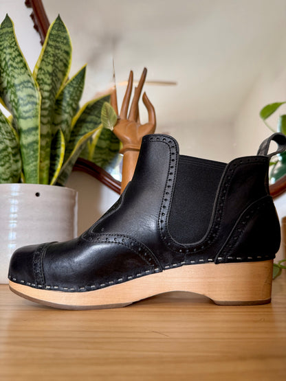 Black leather Swedish Haskbeen bottles with tooled leather detailing