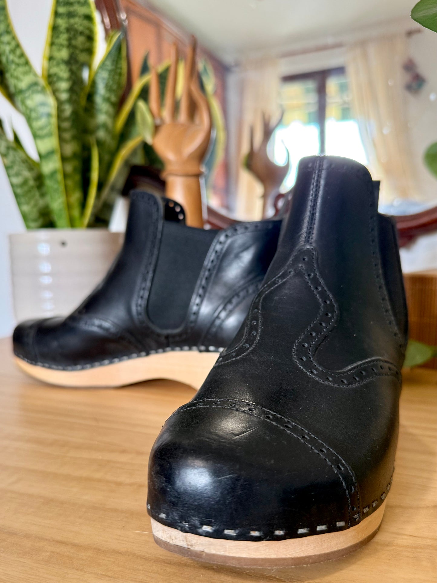 Black leather Swedish Haskbeen bottles with tooled leather detailing