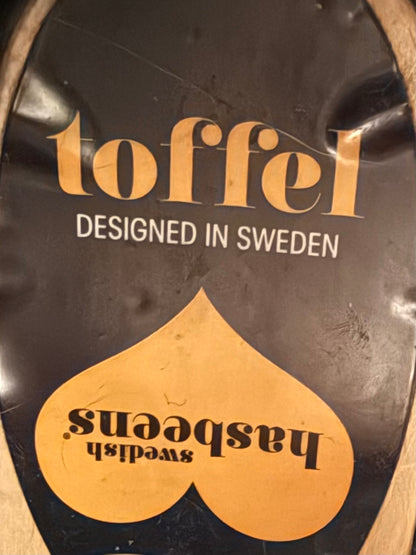 Black leather Swedish Haskbeen bottles with tooled leather detailing