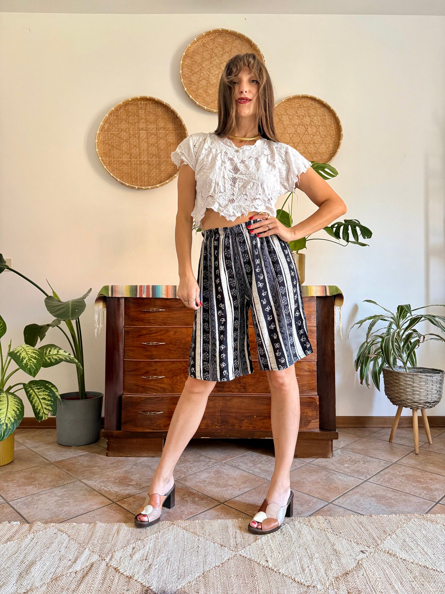 1990's vintage black and tan striped shorts with floral and butterfly print