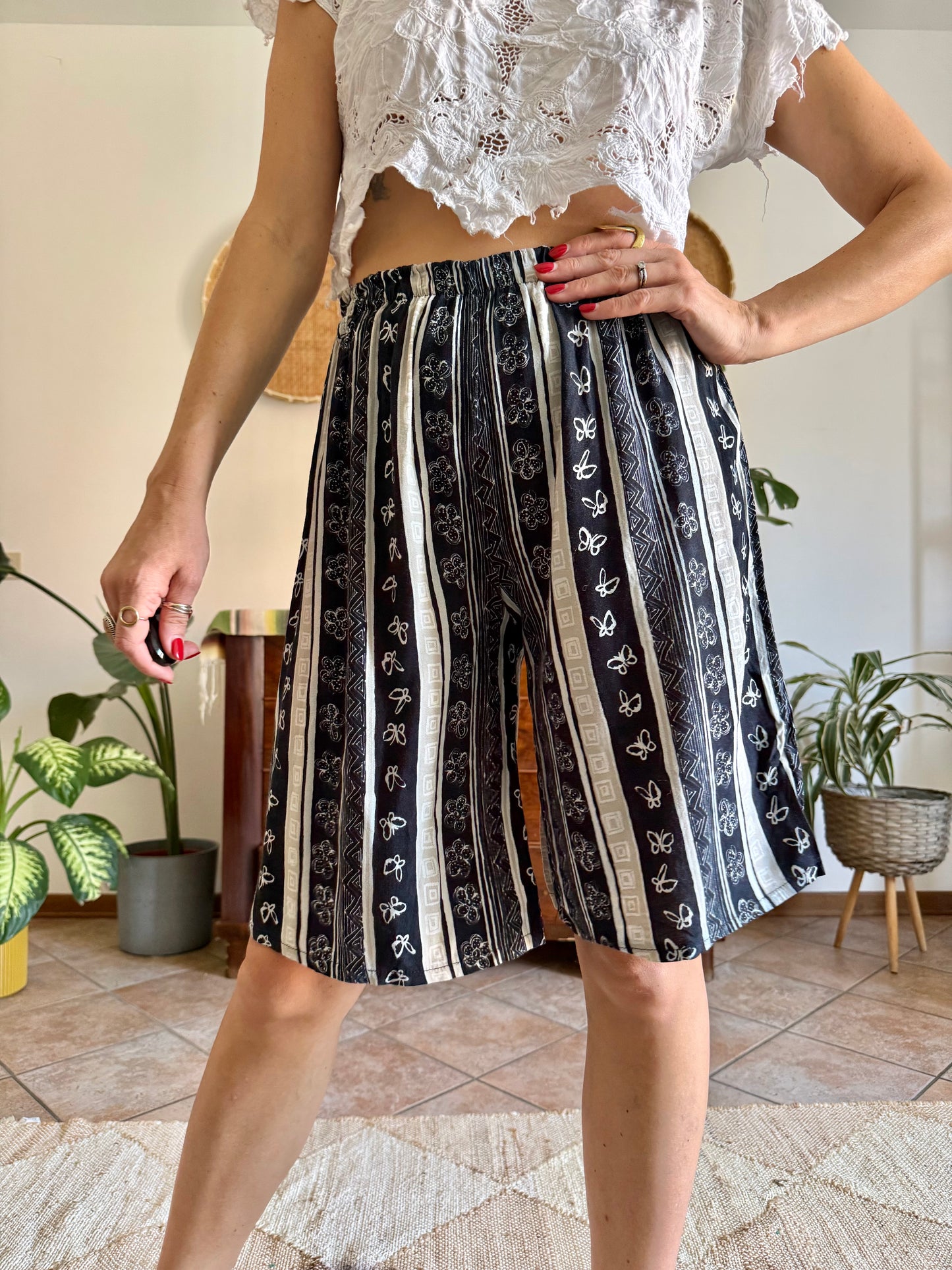 1990's vintage black and tan striped shorts with floral and butterfly print