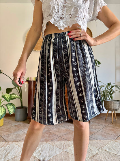 1990's vintage black and tan striped shorts with floral and butterfly print