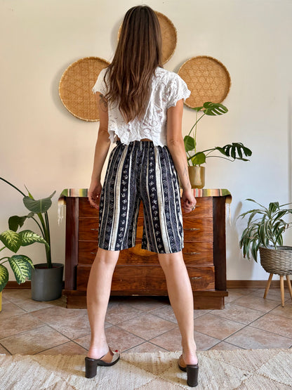 1990's vintage black and tan striped shorts with floral and butterfly print