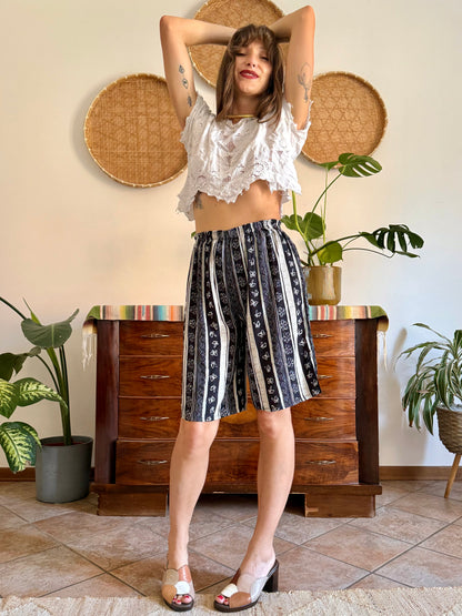 1990's vintage black and tan striped shorts with floral and butterfly print