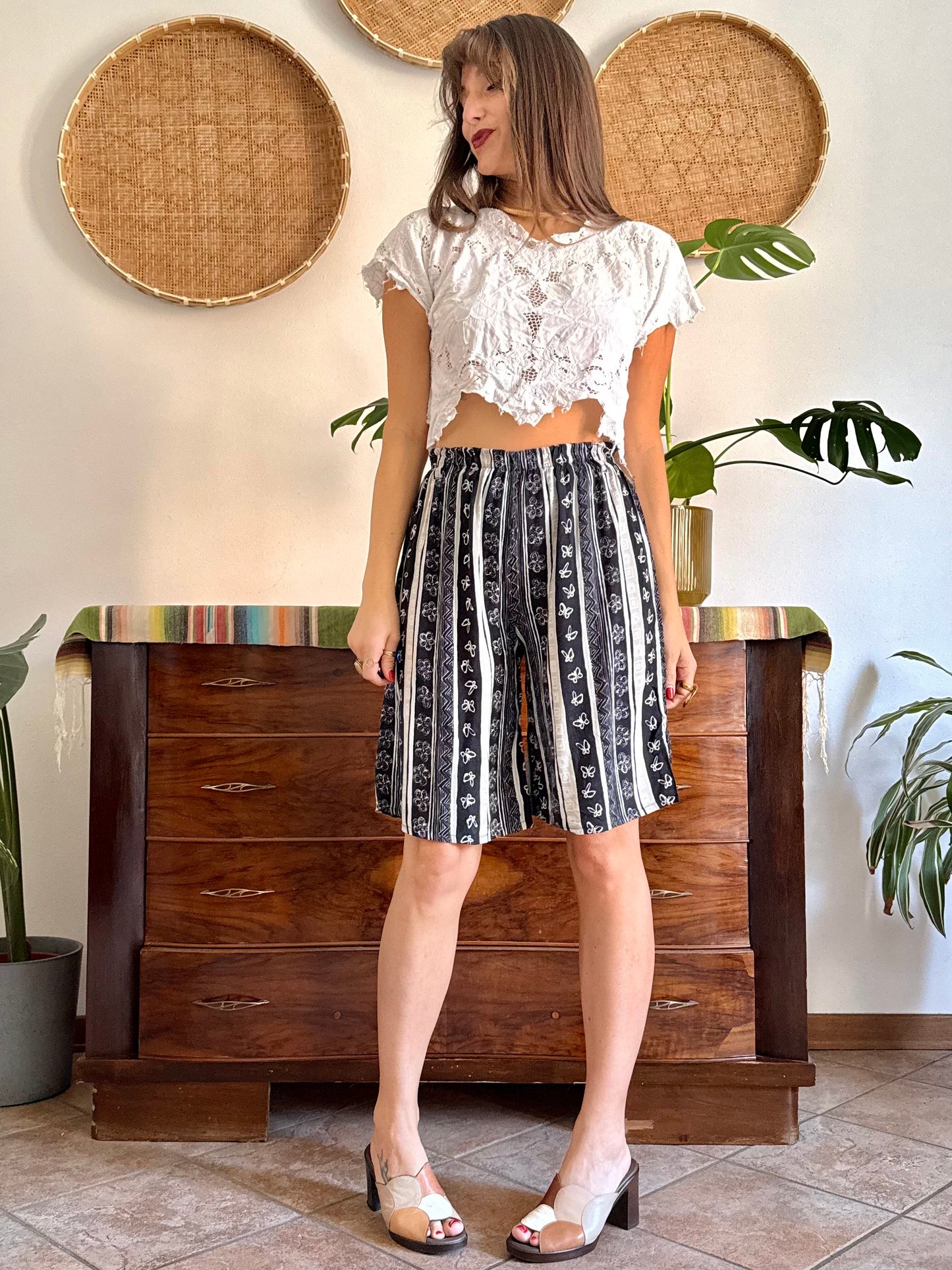 1990's vintage black and tan striped shorts with floral and butterfly print
