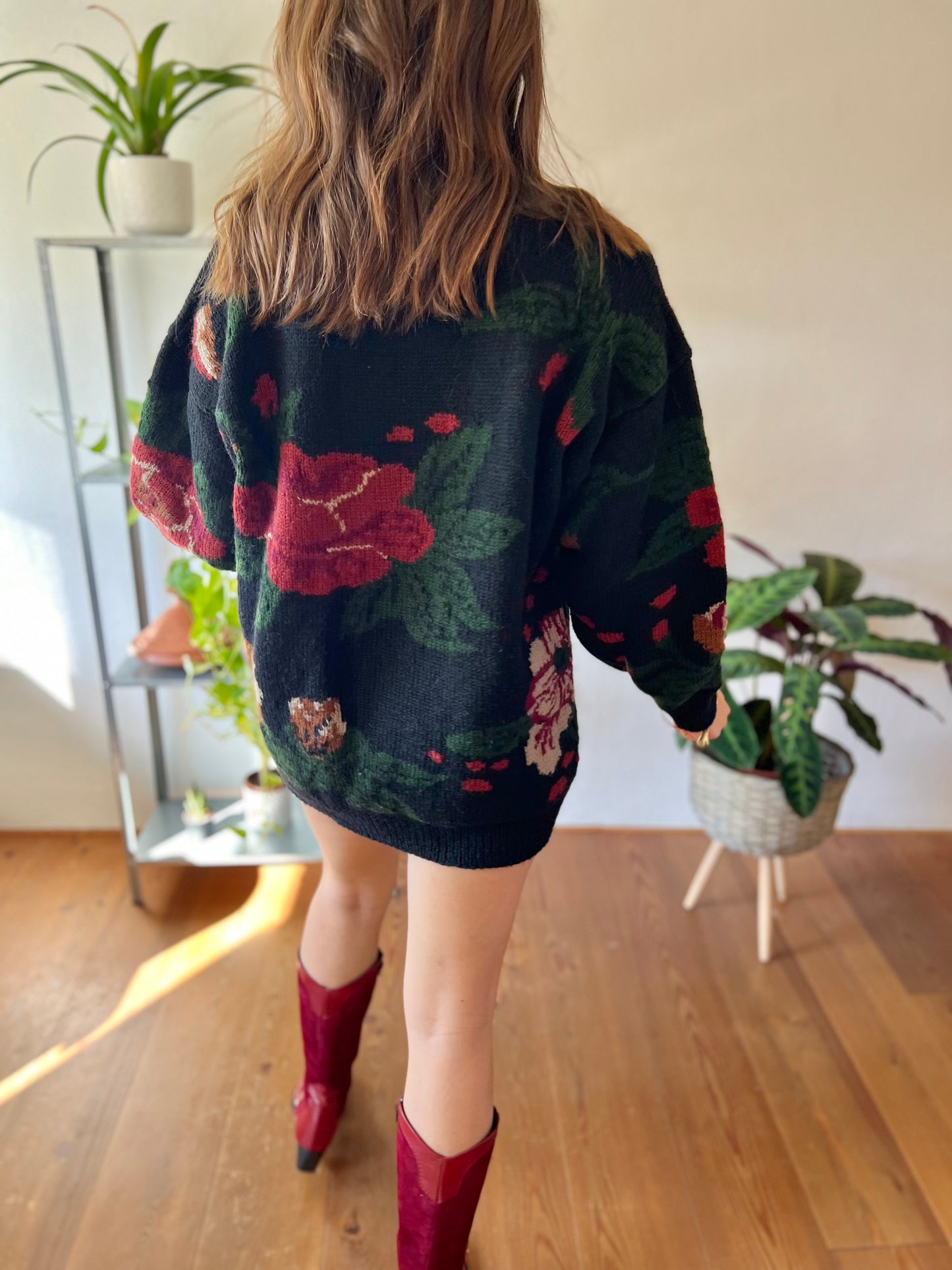 1970's vintage black hand knit pullover with burgundy and green floral pattern