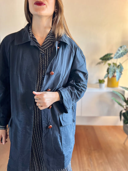 1970's vintage navy blue trench coat with red plaid lining