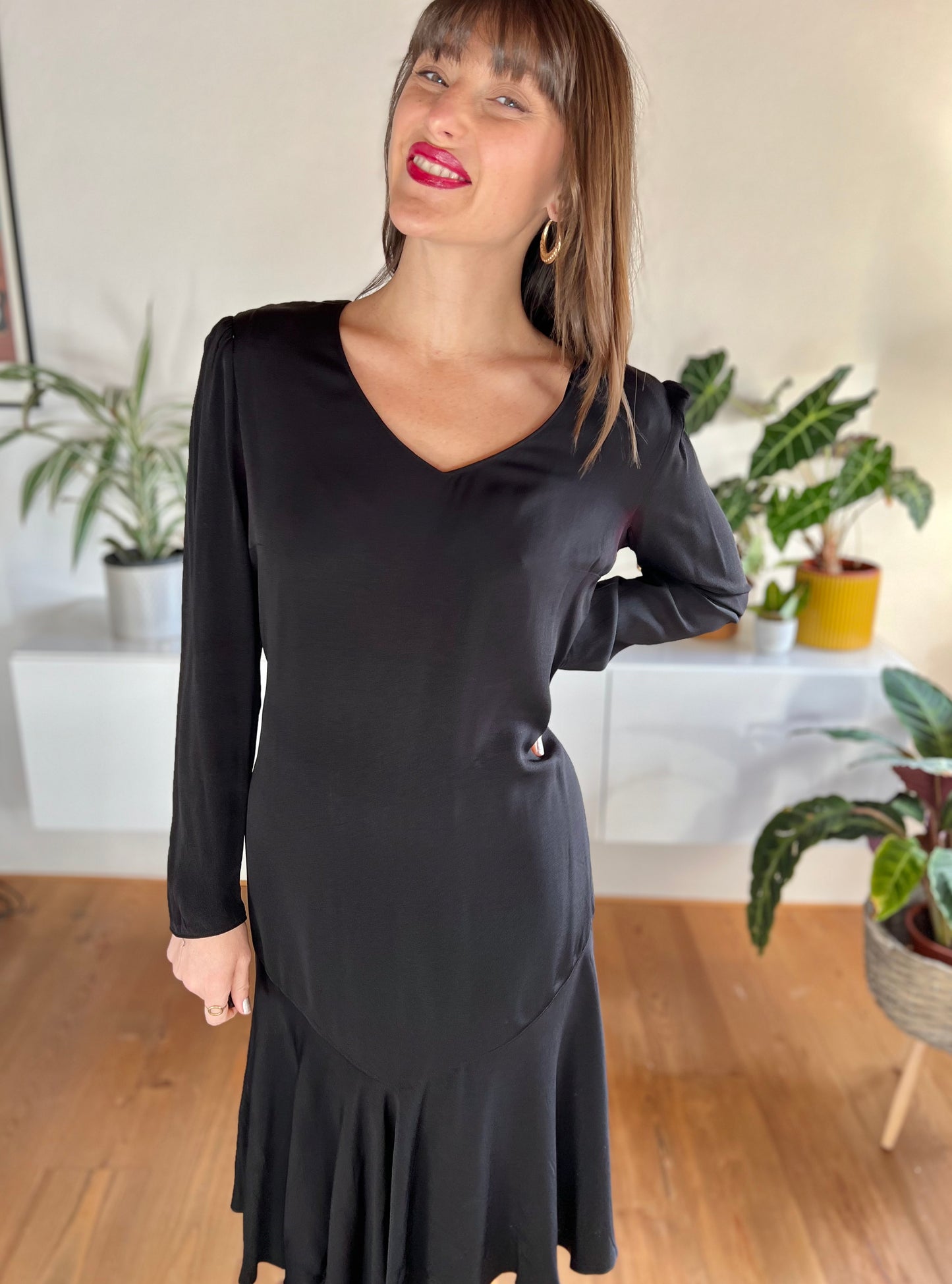 1970's vintage black bias cut midi dress with trumpet ruffle hem