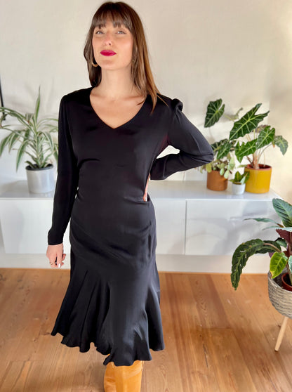 1970's vintage black bias cut midi dress with trumpet ruffle hem