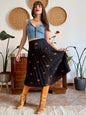 1990's vintage semi sheer black pleated midi skirt with orange polka dot print