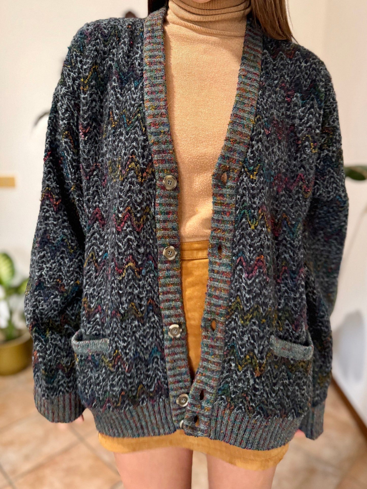 1990's vintage black wool cardigan with rainbow chevron pattern