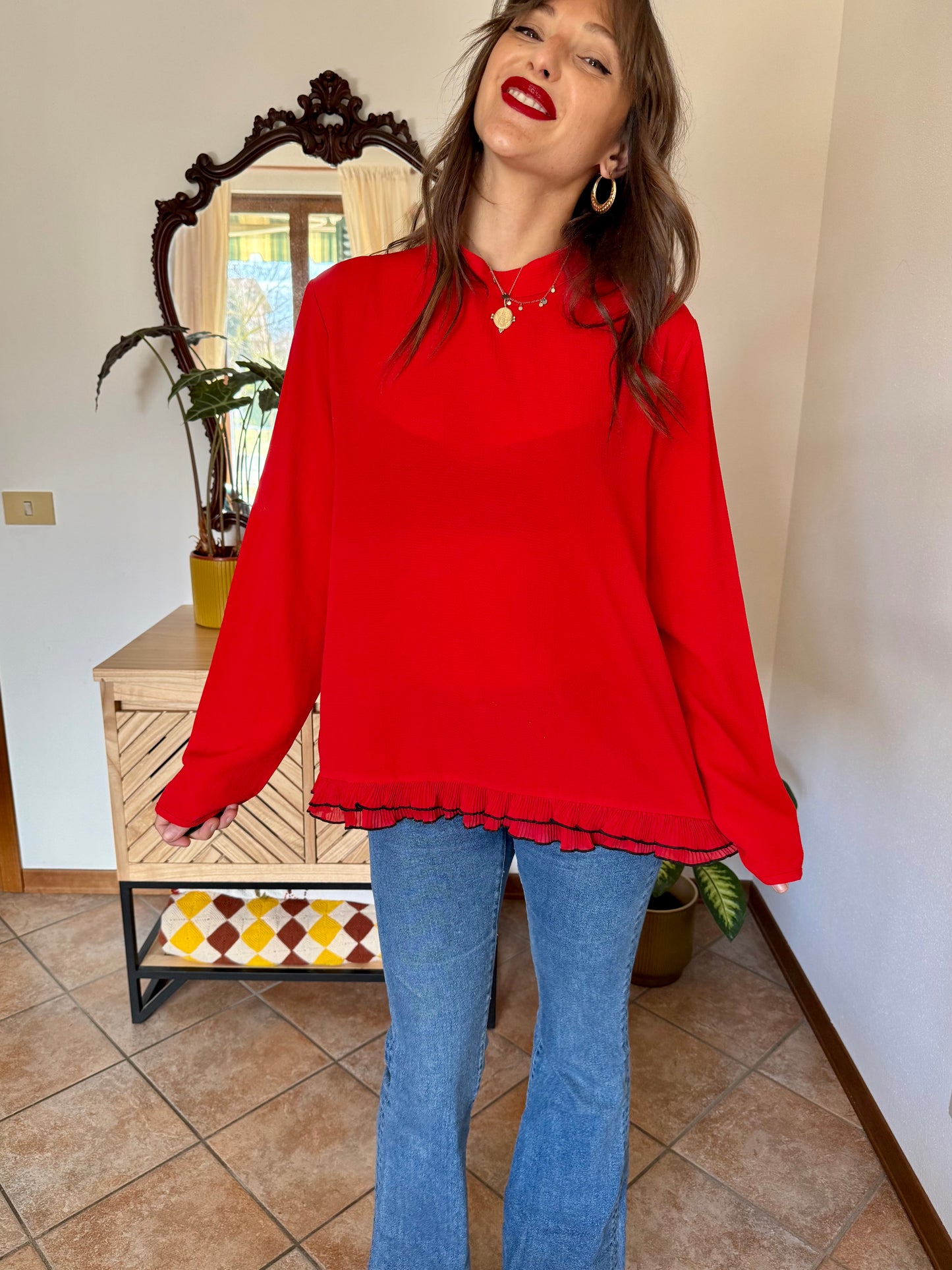 1980's vintage cherry red textured blouse with black ruffle hem