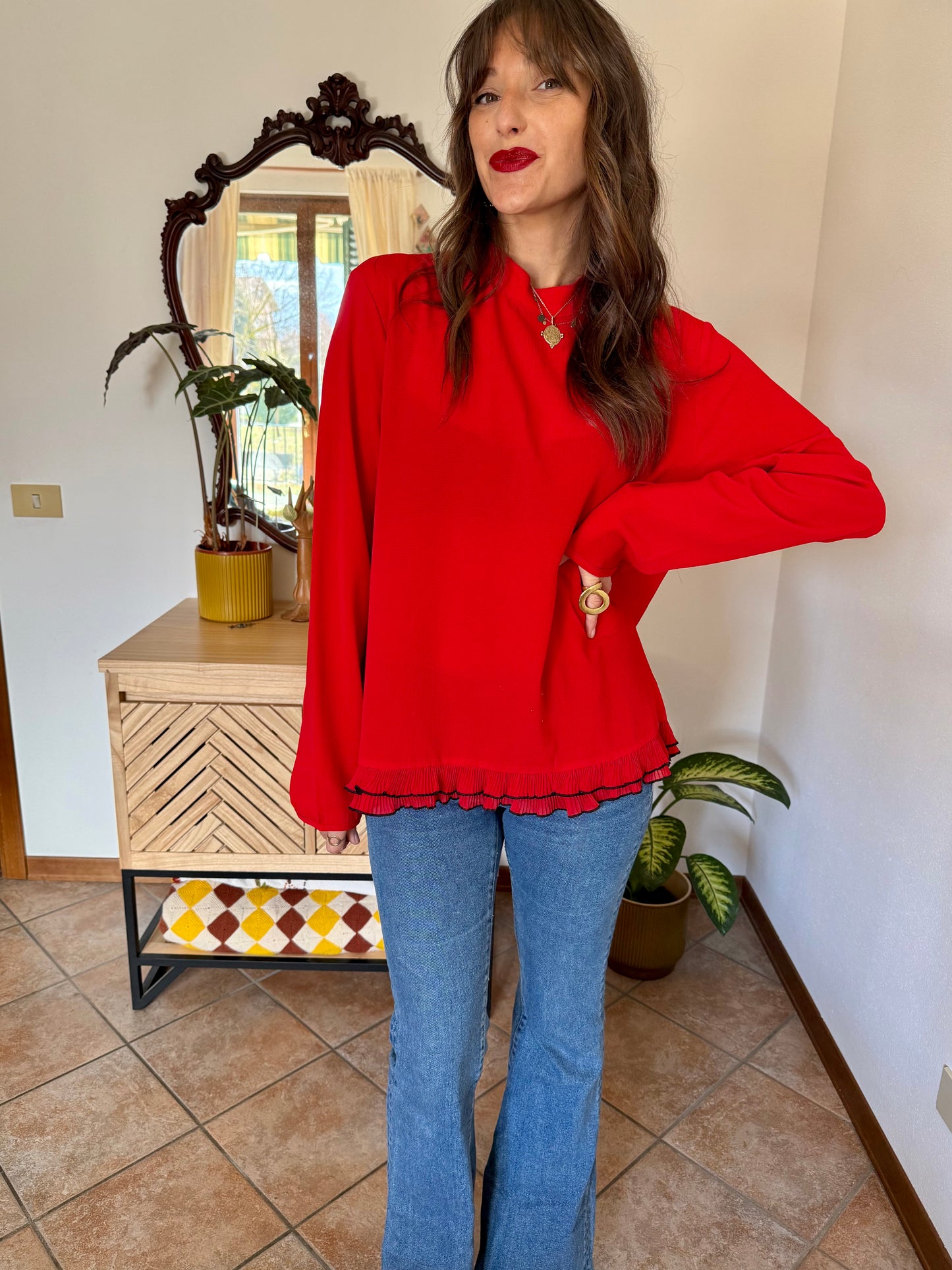 1980's vintage cherry red textured blouse with black ruffle hem